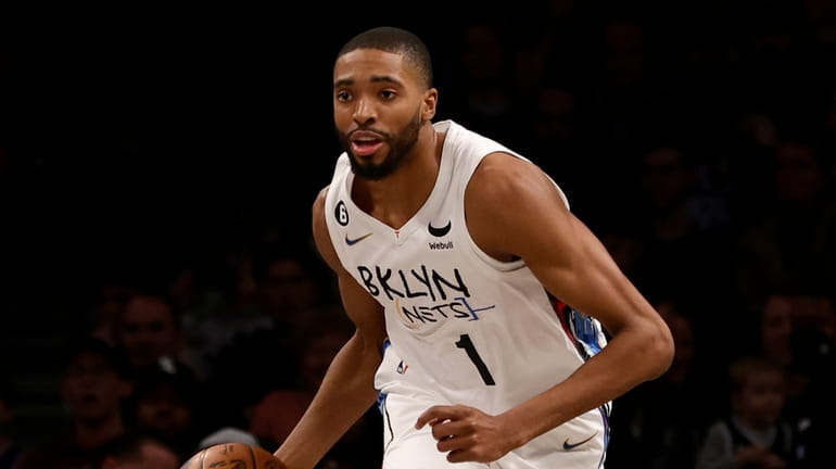 Mikal Bridges #1 of the Nets controls the ball against...