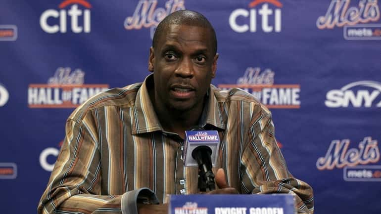 Former player Dwight Gooden speaks during a press conference for...