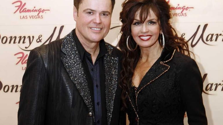 Sibling performers Donny Osmond and Marie Osmond after a performance...