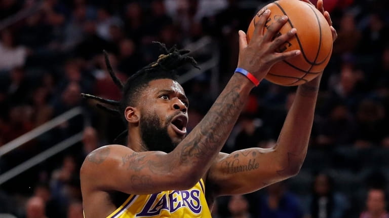 Los Angeles Lakers guard Reggie Bullock attempts a layup during...