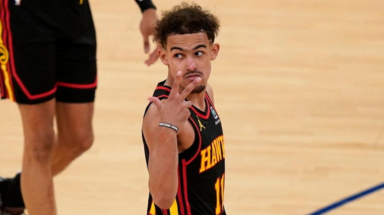 The Hawks' Trae Young gestures during the second half of...