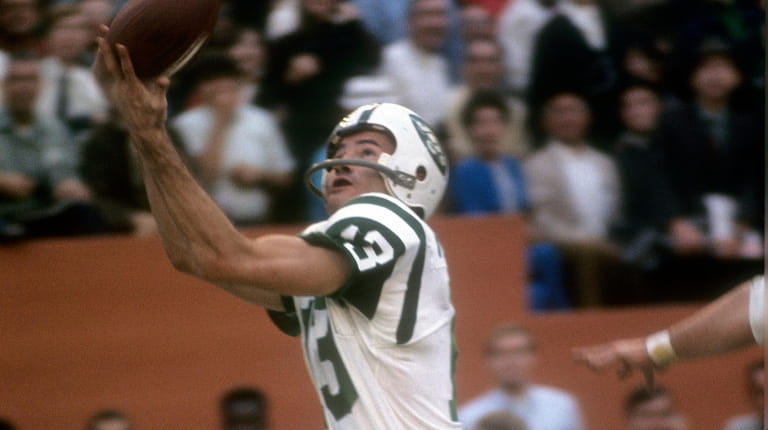 Don Maynard of the New York Jets catches a pass...