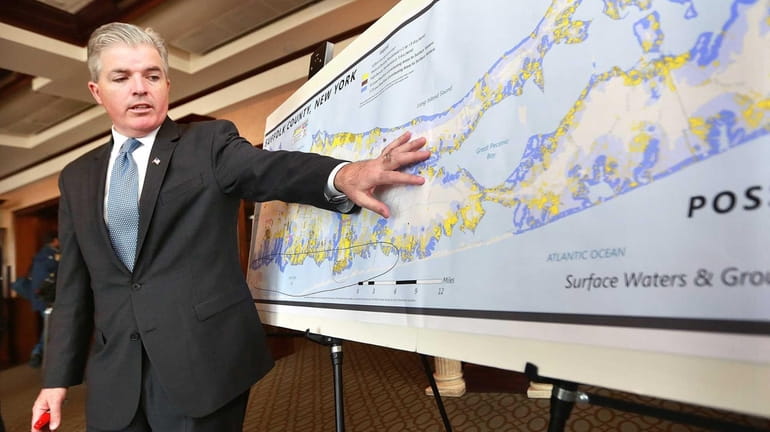 Suffolk County Executive Steve Bellone uses a map of Suffolk...