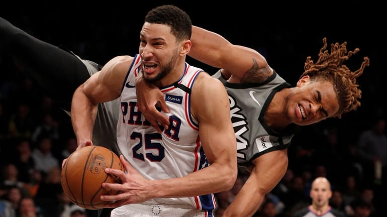 Nicolas Claxton of the Nets fouls Ben Simmons of the 76ers during...