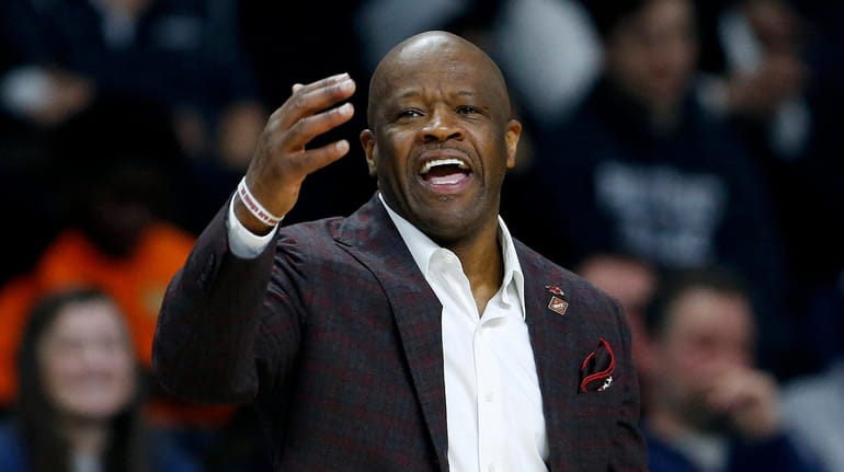 Mike Anderson reacts during the second half of a first...
