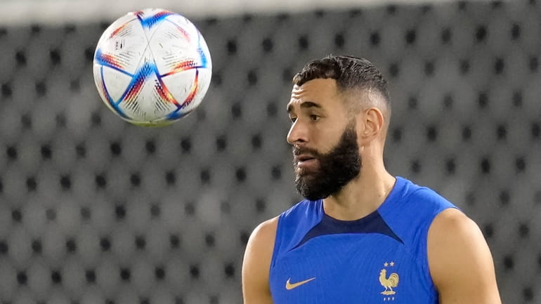 France's Karim Benzema eyes the ball during a training session...