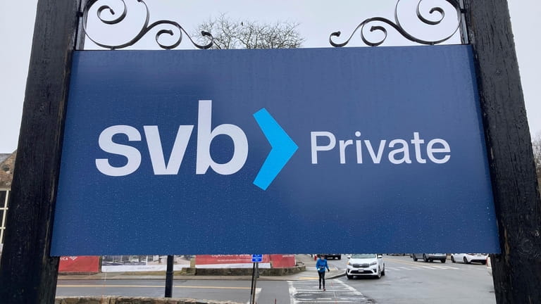 A Silicon Valley Bank sign Saturday outside a branch in Wellesley,...