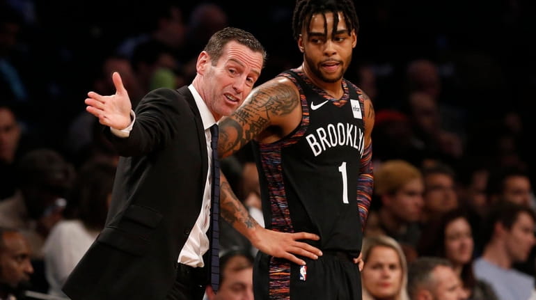 Head coach Kenny Atkinson of the Brooklyn Nets talks with...