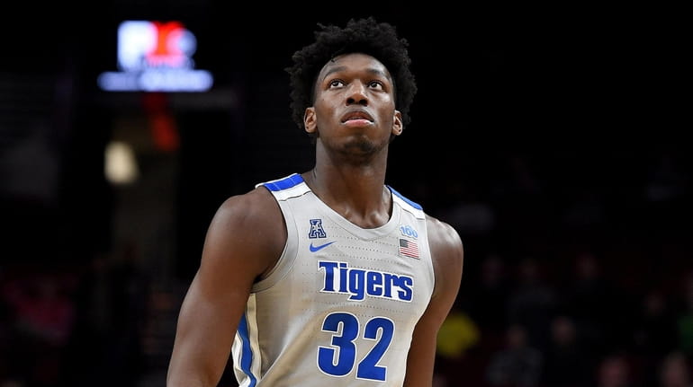James Wiseman of Memphis walks up court during a game...