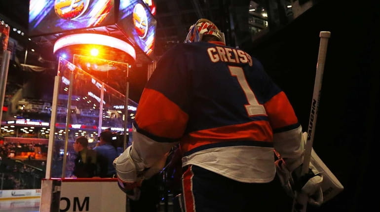 Thomas Greiss of the New York Islanders leads his teammates...