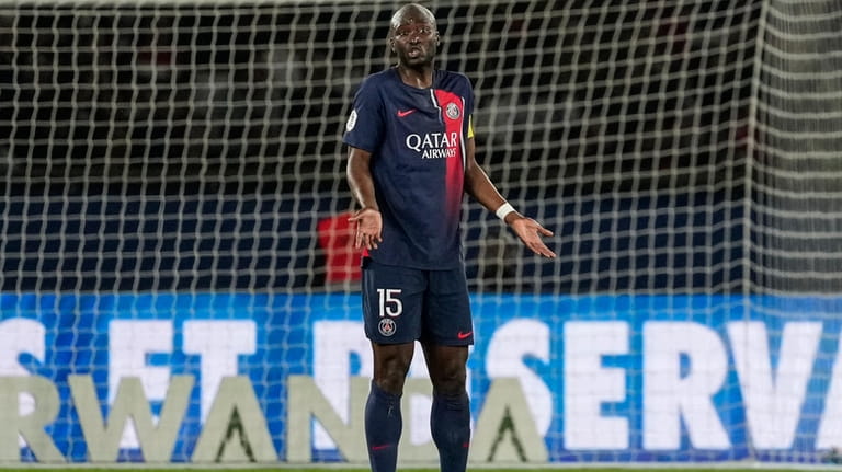 PSG's Danilo Pereira reacts after Clermont's Habib Keita scoring his...
