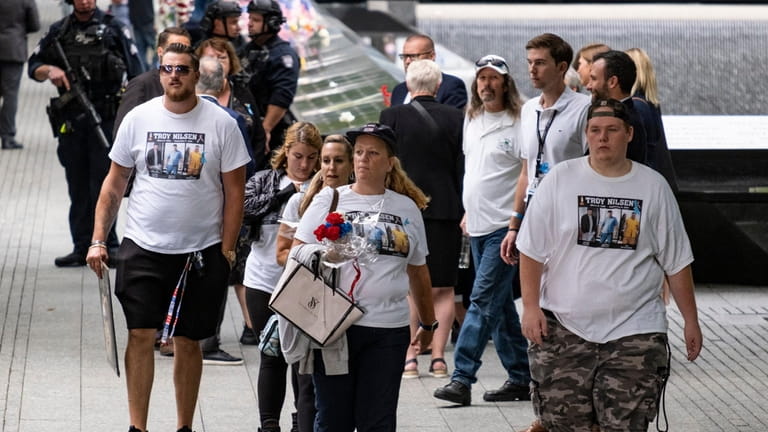 Attendees wear shirts in honored of a loved one at...