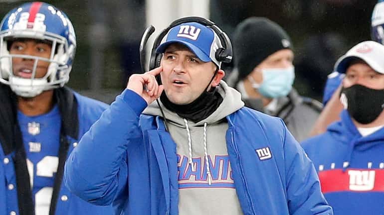 Head coach Joe Judge of the Giants reacts on the sidelines during...