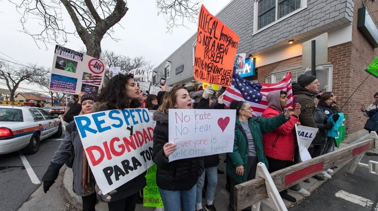 Long Island demonstrators protest immigration policy on Feb. 3, 2017,...