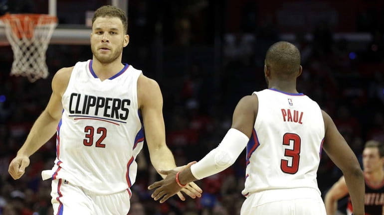 Blake Griffin celebrates a made three with teammate Chris Paul....