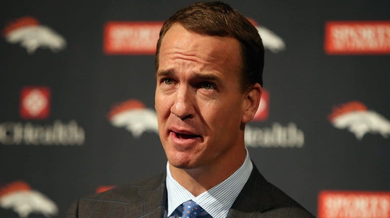 Quarterback Peyton Manning addresses the media as he announces his...