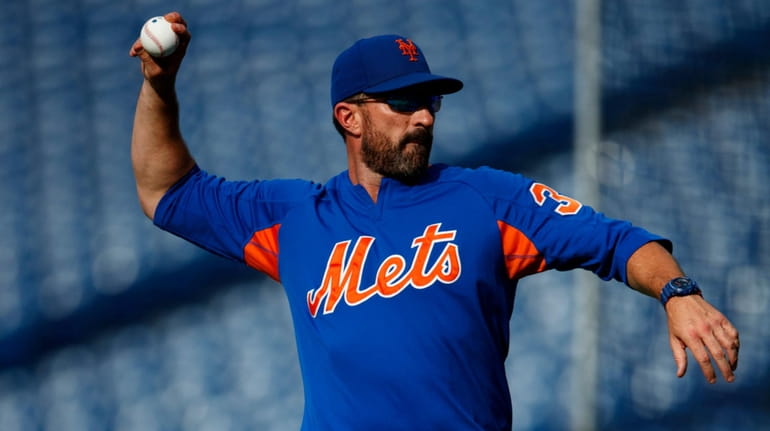 Mets manager Mickey Callaway throws batting practice before a game against...