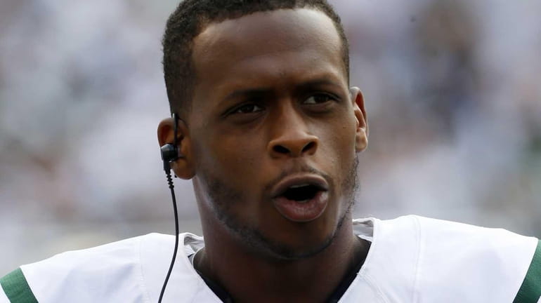 Geno Smith of the New York Jets looks on during...
