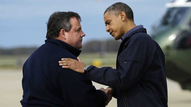 President Barack Obama is greeted by New Jersey Gov. Chris...