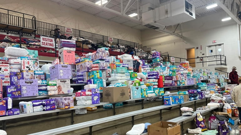 Diapers are stacked inside the gym at Indian Lake High...