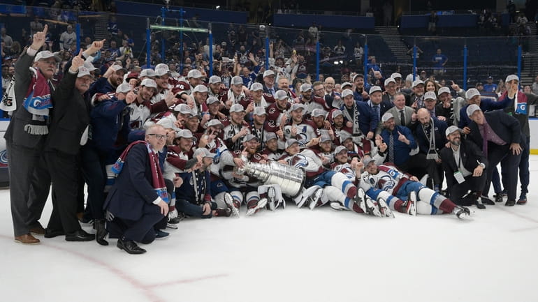 The Avalanche pose with the Stanley Cup after defeating the...