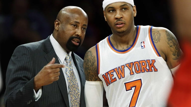 Mike Woodson talks to Carmelo Anthony during the first half...