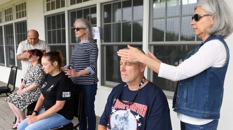 Veterans receive energy treatments and relaxation techniques at the sixth...