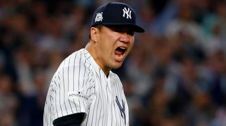 Yankees pitcher Masahiro Tanaka reacts during Game 5 of the...