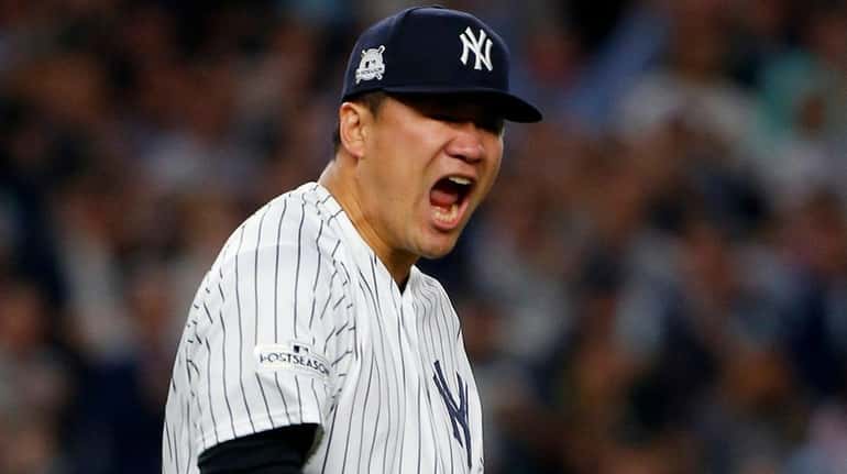 Yankees pitcher Masahiro Tanaka reacts during Game 5 of the...