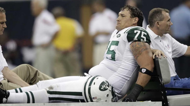 New York Jets offensive tackle Robert Turner is carted off...