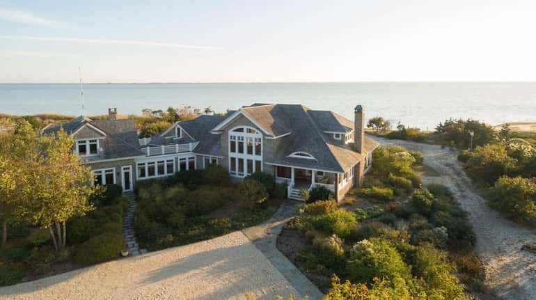 This waterfront mansion in Patchogue is being auctioned off.