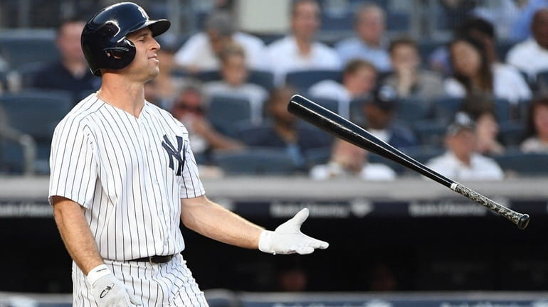 Yankees leftfielder Brett Gardner tosses his bat after he struck...