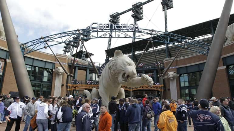 Fans outside Comerica Park before a baseball game between the...