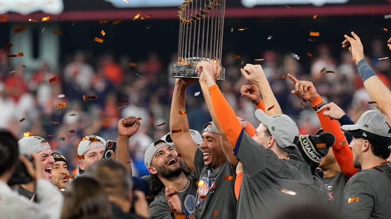 The Astros celebrate their 4-1 World Series win against the...