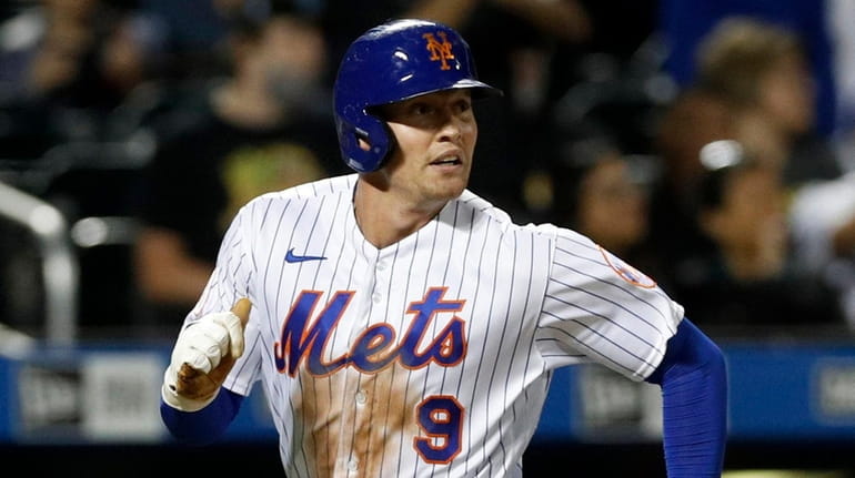 Brandon Nimmo of the Mets scores a run in the fourth inning...