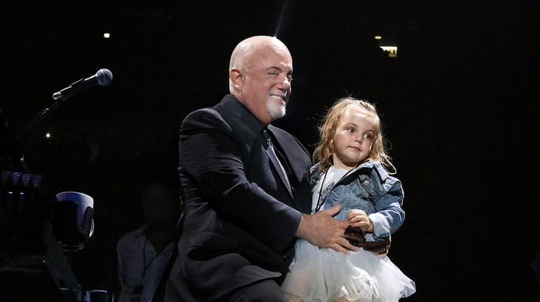 Billy Joel performs on stage with his daughter Della Rose...