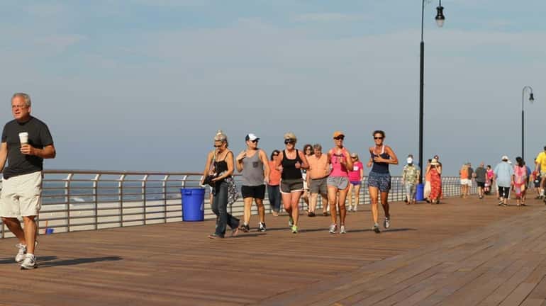 Long Beach officially reopens part of the boardwalk. Many people...