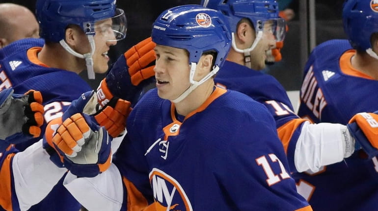The Islanders' Matt Martin celebrates with teammates after scoring a...