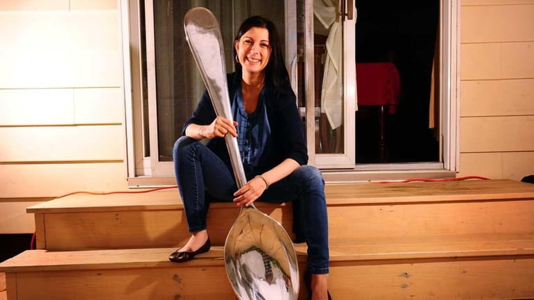Christine Miserandino with one of her spoons from a collection;...