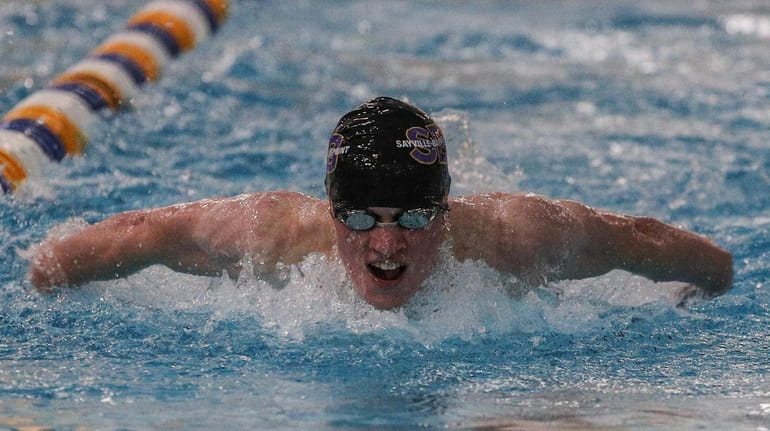 Colin Caraher of Sayville/Bayport-Blue Point wins the 100-yard butterfly in...