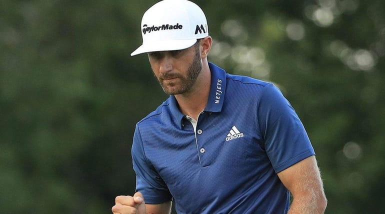 Dustin Johnson reacts after a par save on the 16th...