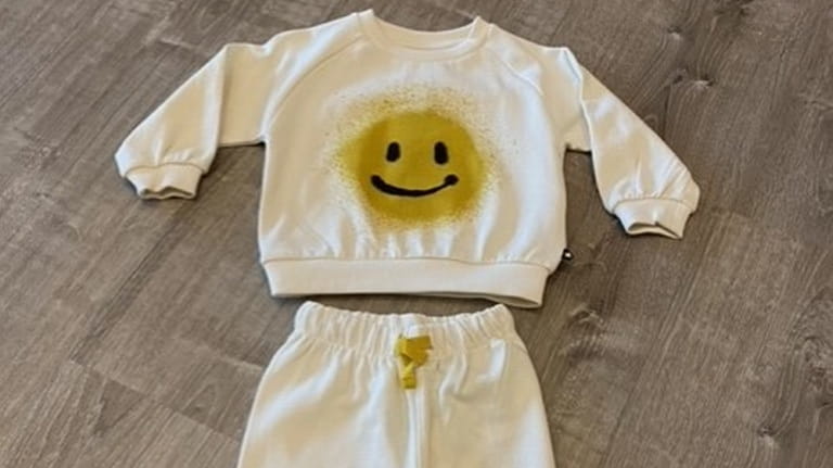 The soft and cozy Molo smiley sweatsuit from Koukla in...