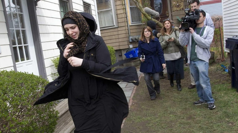 Katherine Russell Tsarnaev, wife of Tamerlan Tsarnaev, leaving the house...