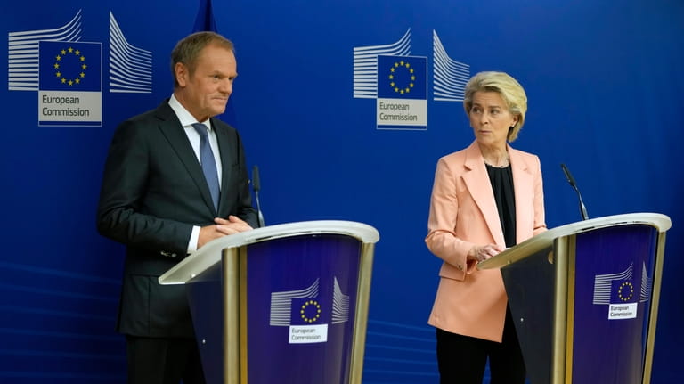 Leader of the Polish Civic Coalition Donald Tusk, left, and...