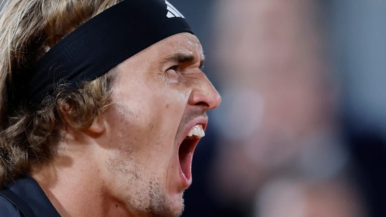 Germany's Alexander Zverev reacts as he wins the second set...