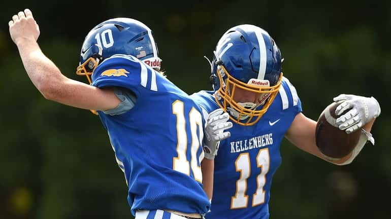 Sean Cannon, Kellenberg wide receiver, right, gets congratulated by teammate...