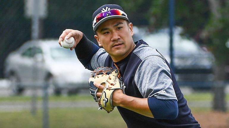 Yankees pitcher Masahiro Tanaka works out during spring training at...