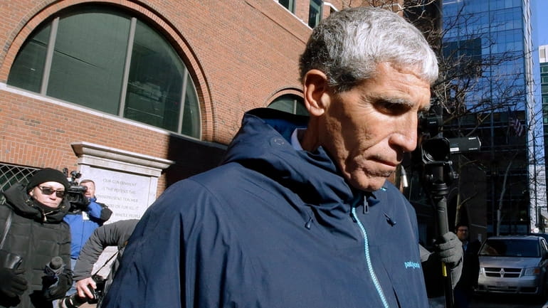 Rick Singer leaves federal court in Boston on March 12, 2019.
