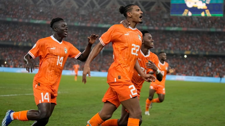 Ivory Coast 's Sebastien Haller celebrates after scoring his side's...