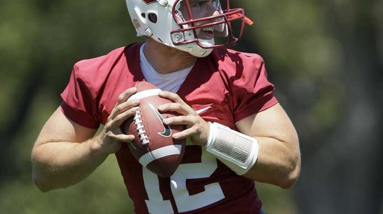 Stanford quarterback Andrew Luck drops back to pass during NCAA...